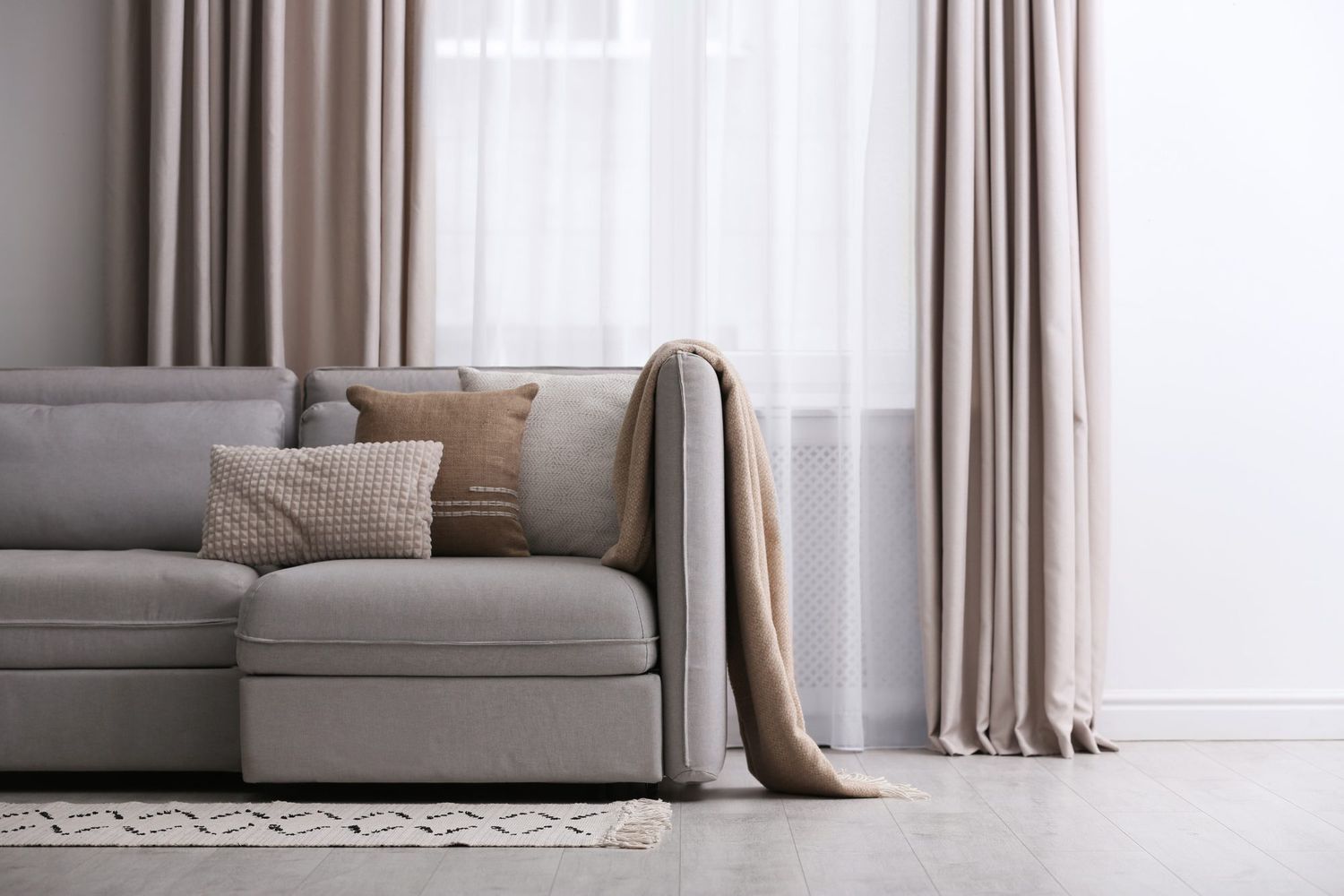 How Often Should I Looks Behind Couches and Curtains to Clean Dust