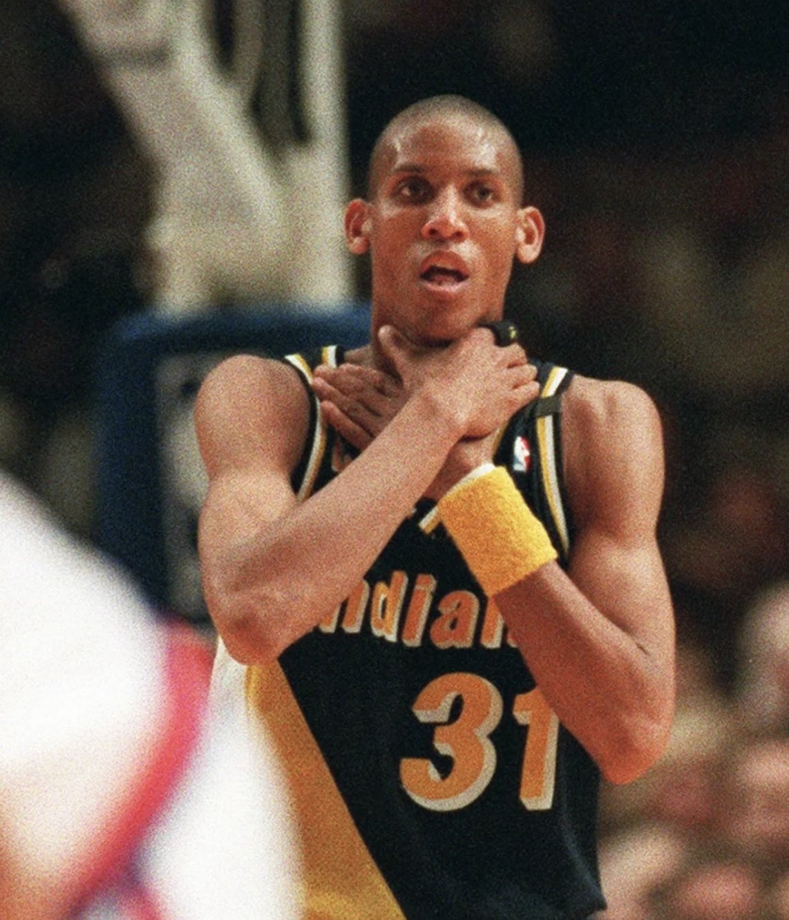 What is the famous Reggie Miller choke pose all about? Understanding this iconic and unforgettable NBA taunt.